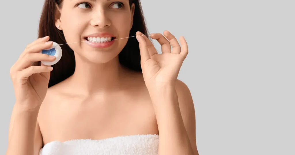 Woman Flossing
